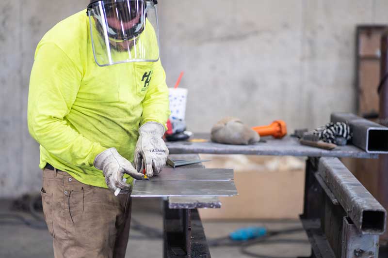 H&H employee working on metal fabrication project