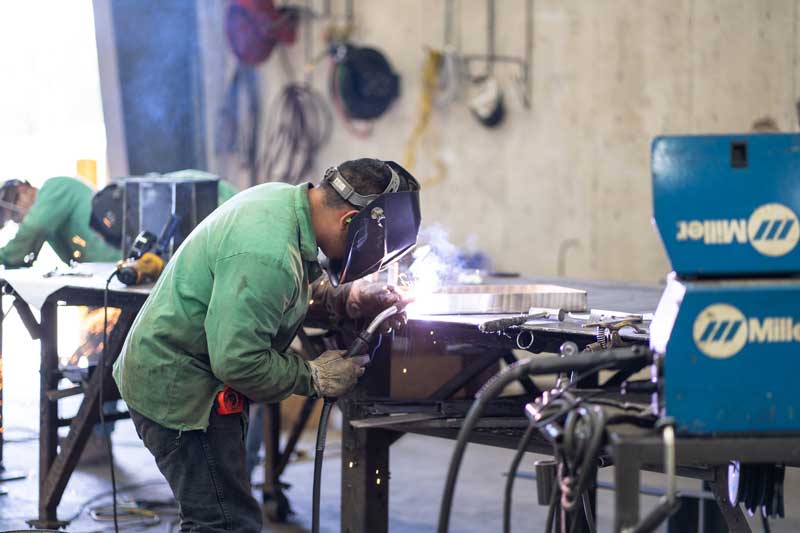 H&H employee working on welding project