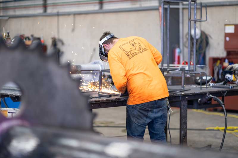 H&H employee working on cutting metal